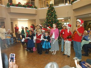 Singing We Wish You a Merry Christmas to the residents of Camden Springs Assisted Living